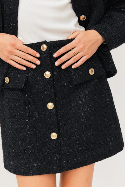 Jupe courte en tweed boutons dorés
