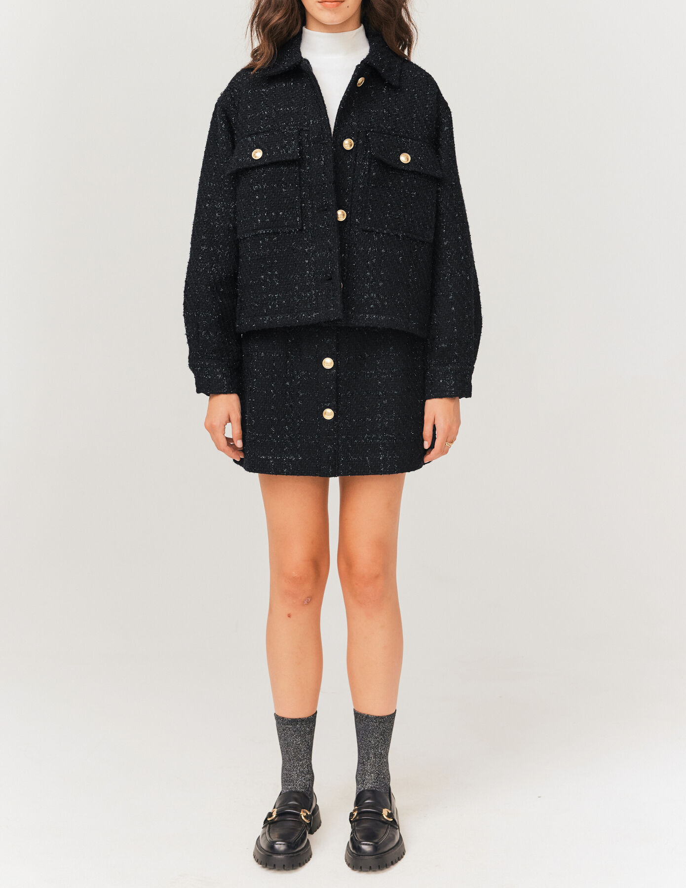 Jupe courte en tweed boutons dorés