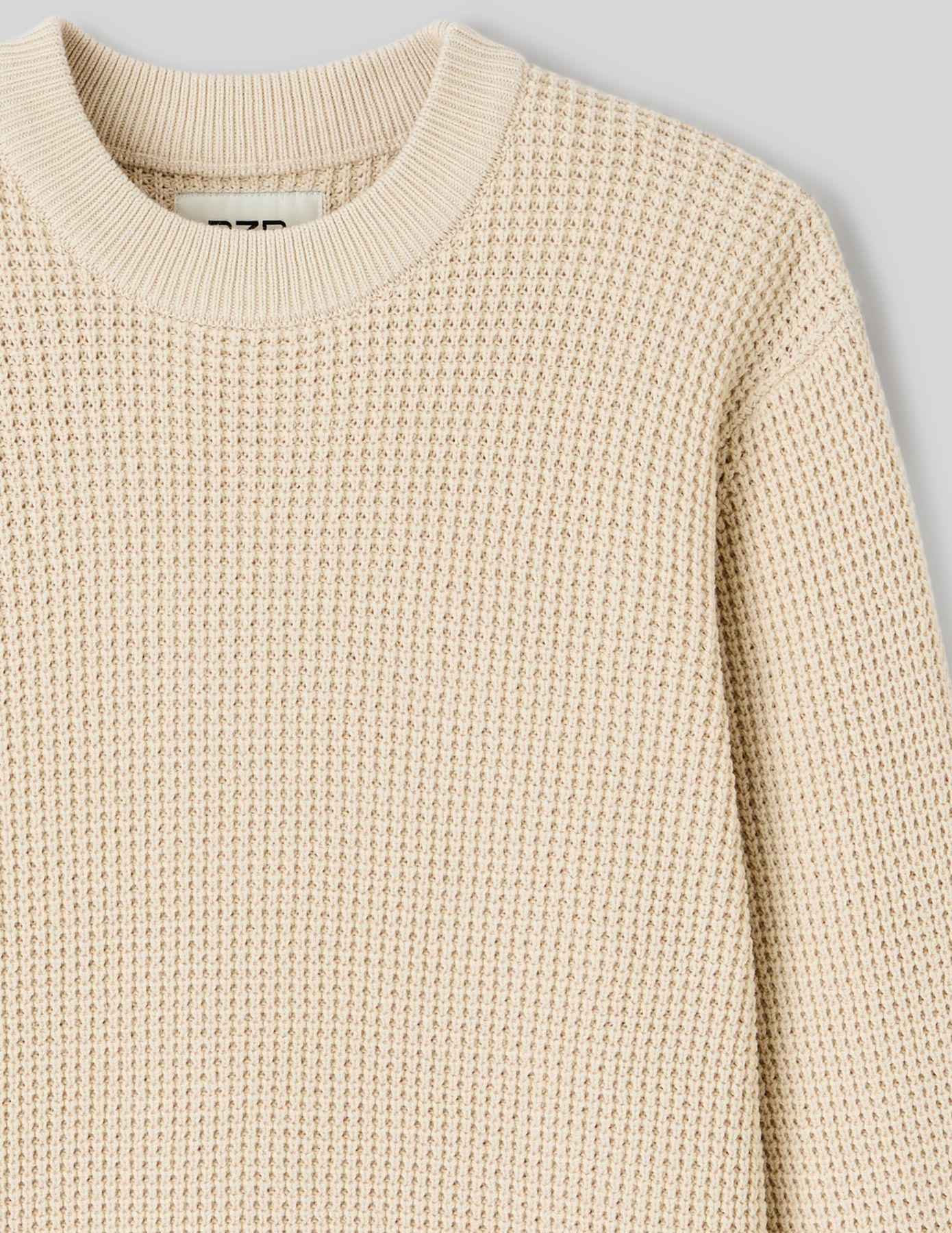 Pull col rond matière fantaisie