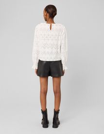 Jupe short en tissu enduit