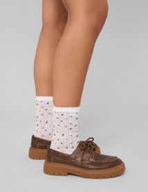 Paire de chaussettes unitaire en pointelle
