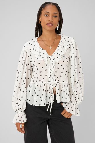 Blouse &agrave; volants motif pois