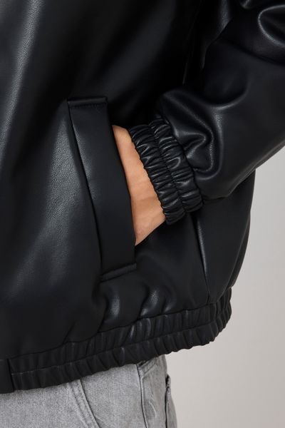 Blouson zippé en tissu enduit