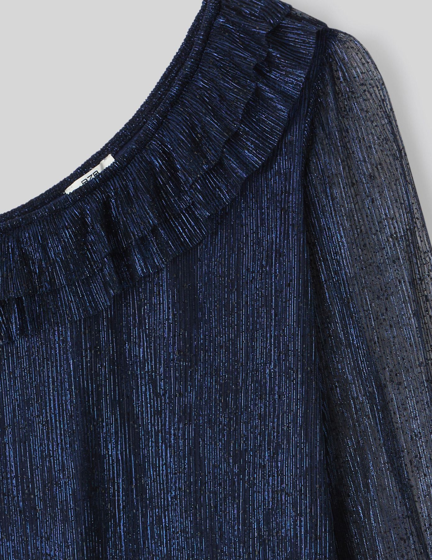 Blouse asymétrique pailletée