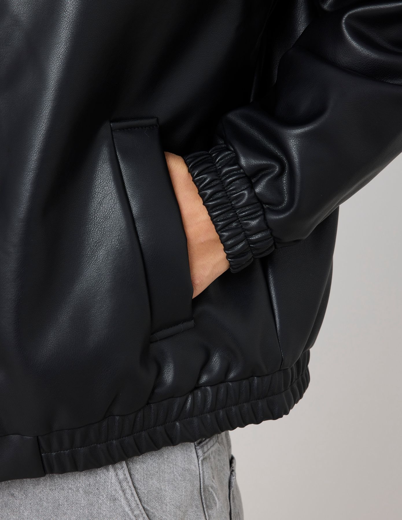 Blouson zippé en tissu enduit