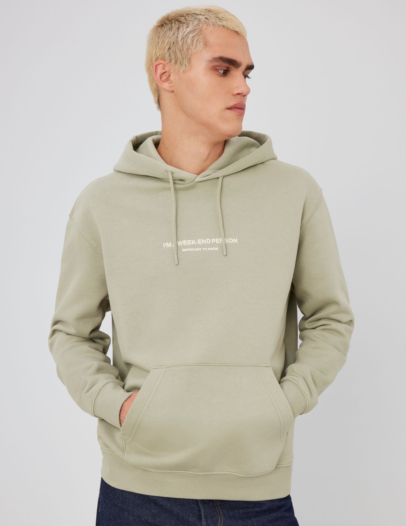 Sweat à capuche message brodé