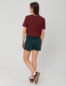 Jupe short portefeuille avec bouton doré