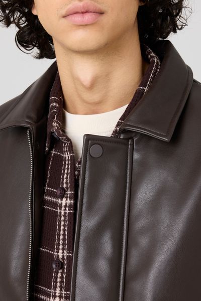 Blouson zippé en tissu enduit