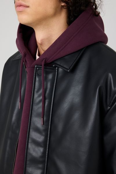 Blouson zippé en tissu enduit