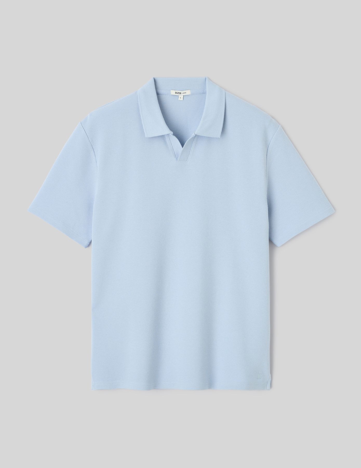 Polo mati&egrave;re gaufr&eacute;e