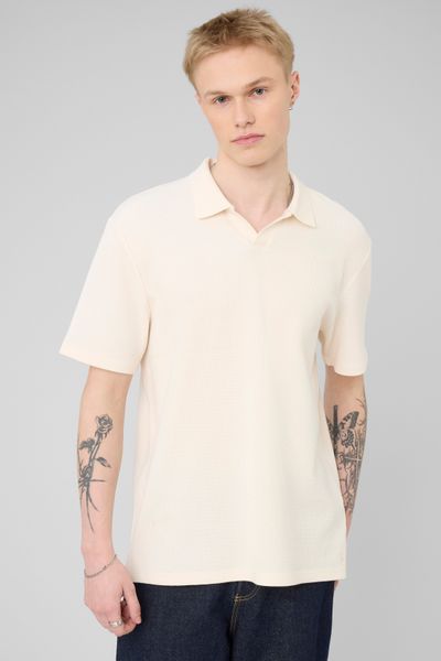 Polo mati&egrave;re gaufr&eacute;e