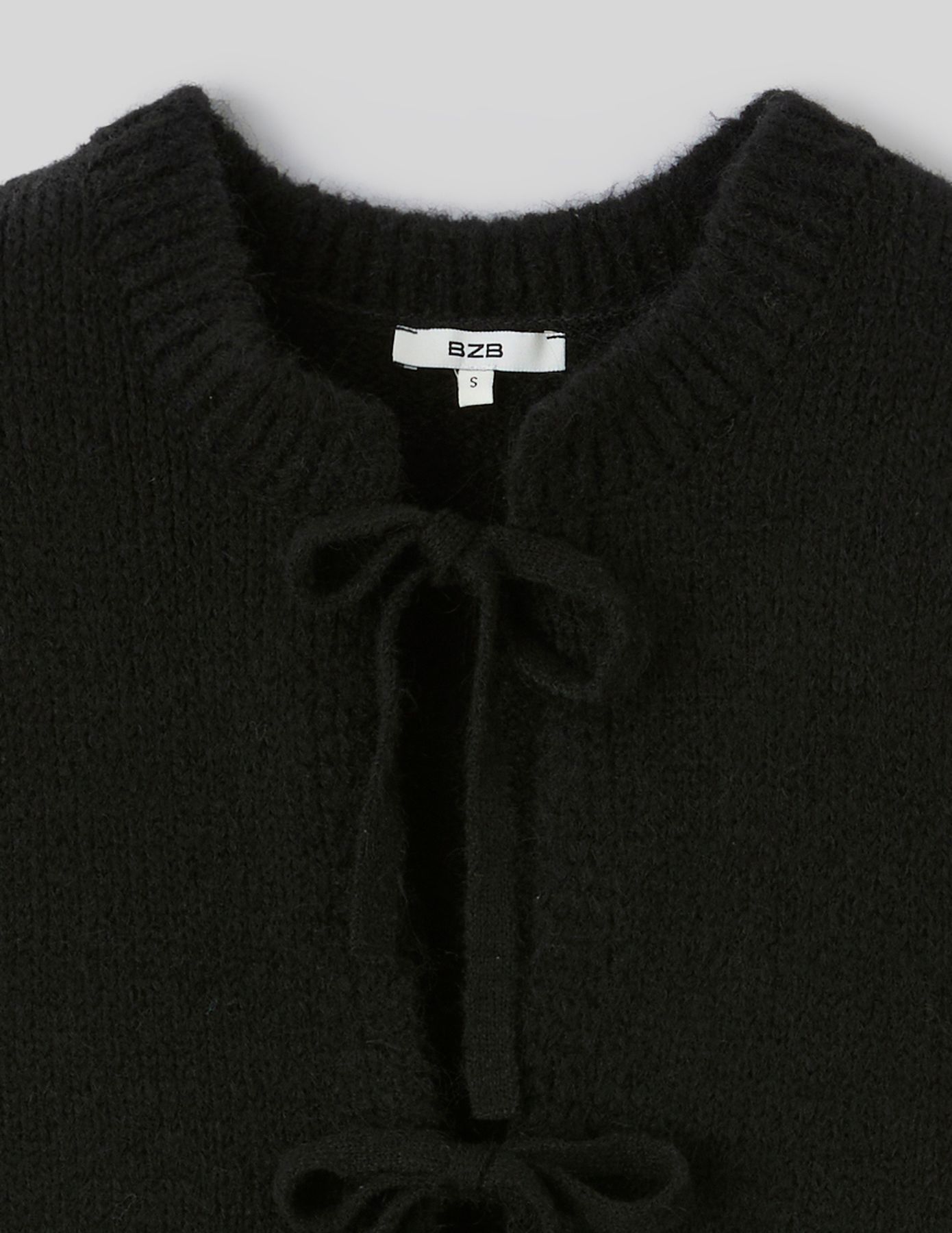 Gilet sans manches &agrave; noeuds