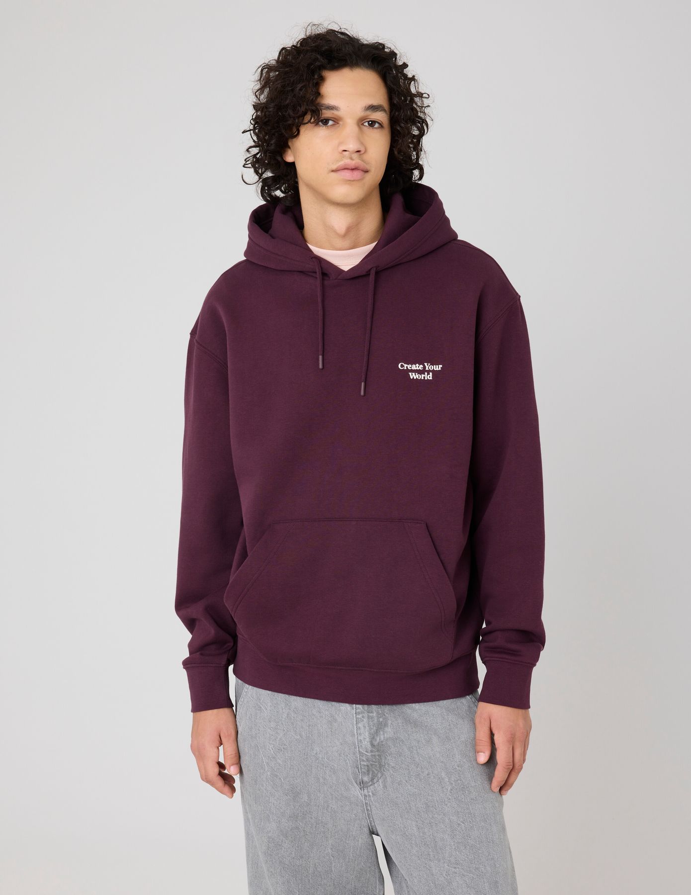 Sweat à capuche message brodé