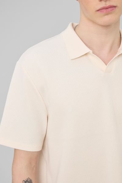 Polo mati&egrave;re gaufr&eacute;e