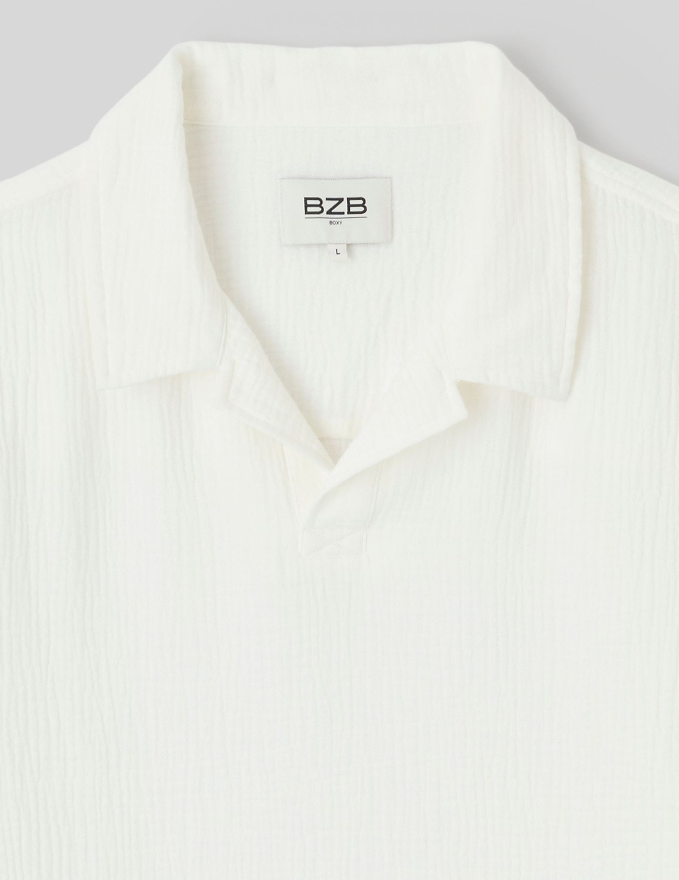 Polo en mati&egrave;re textur&eacute;e