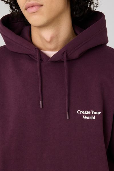 Sweat à capuche message brodé