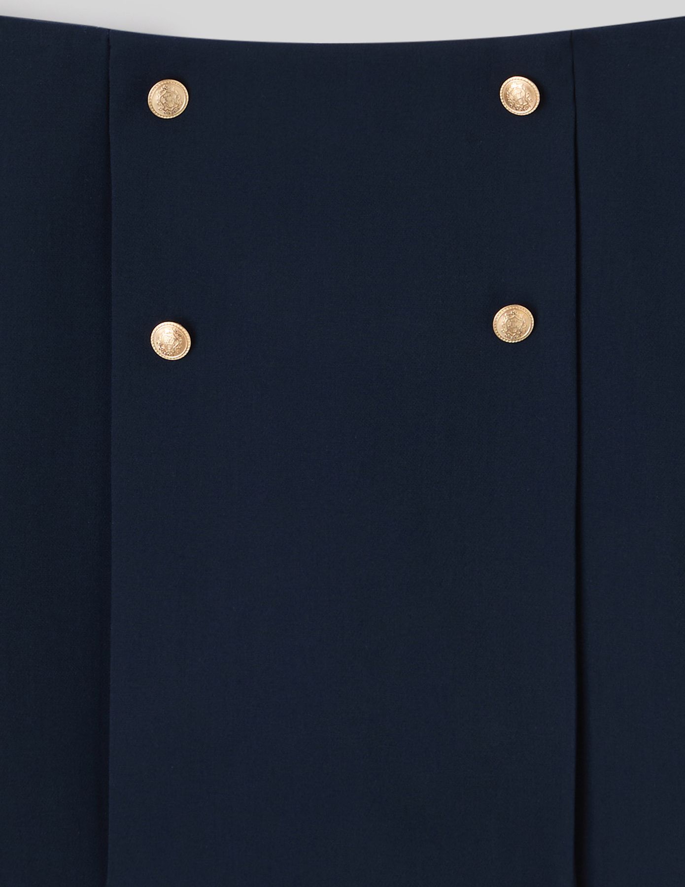 Jupe courte avec boutons dorés