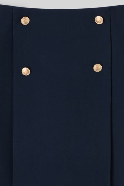 Jupe courte avec boutons dorés