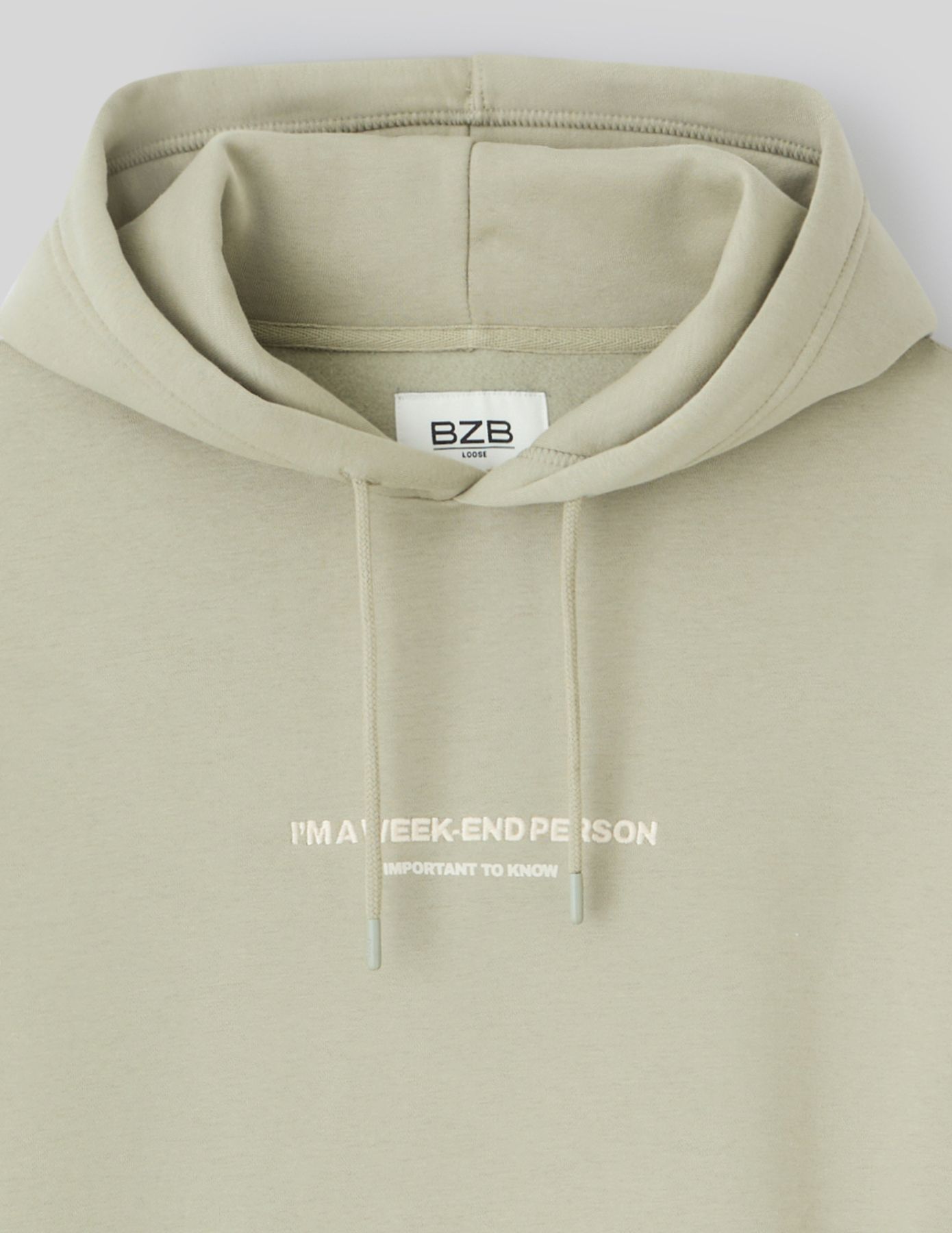Sweat à capuche message brodé