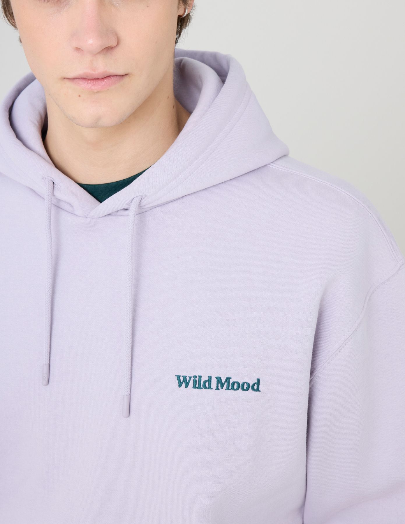 Sweat à capuche message brodé