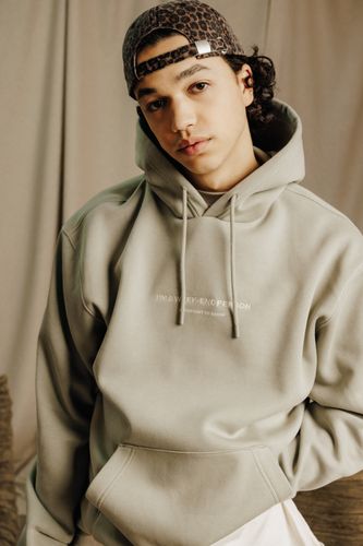 Sweat à capuche message brodé