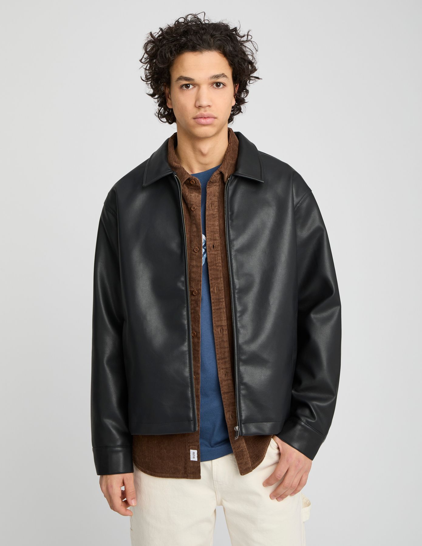 Blouson zippé en tissu enduit