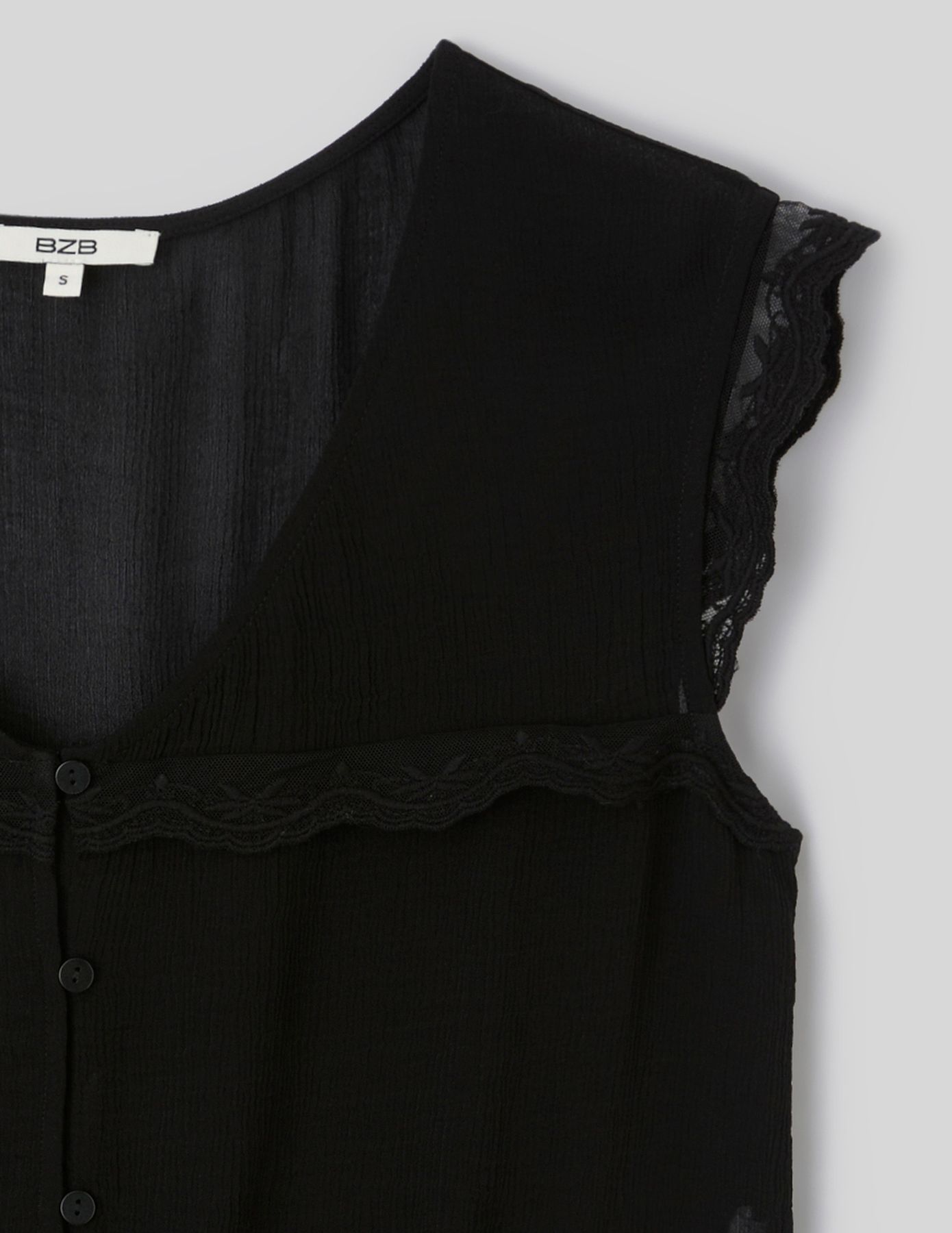 Blouse sans manches &agrave; volants