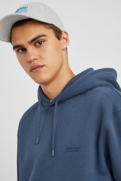 Sweat à capuche message brodé
