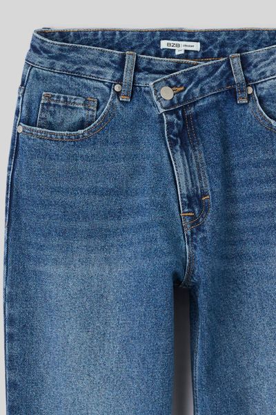 Jean straight ceinture asym&eacute;trique
