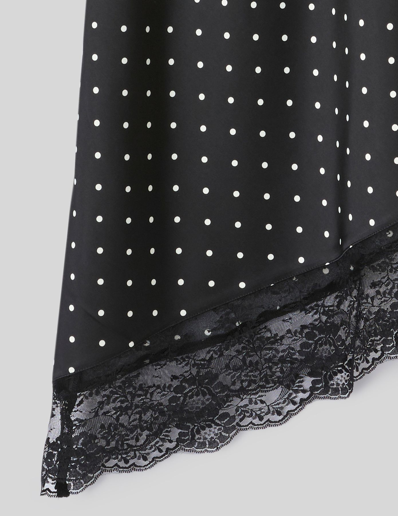 Jupe midi asym&eacute;trique &agrave; pois