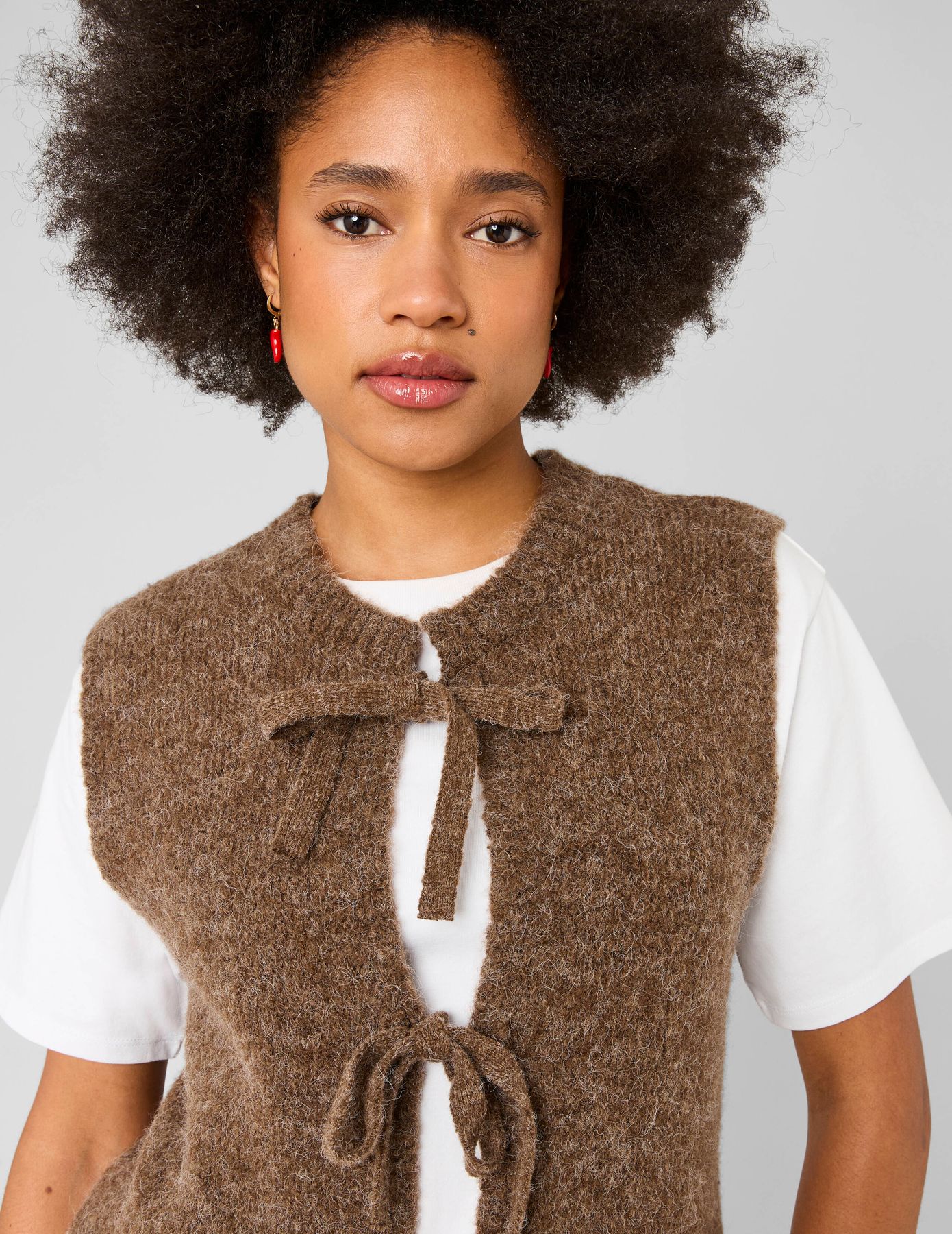 Gilet sans manches &agrave; n&oelig;uds