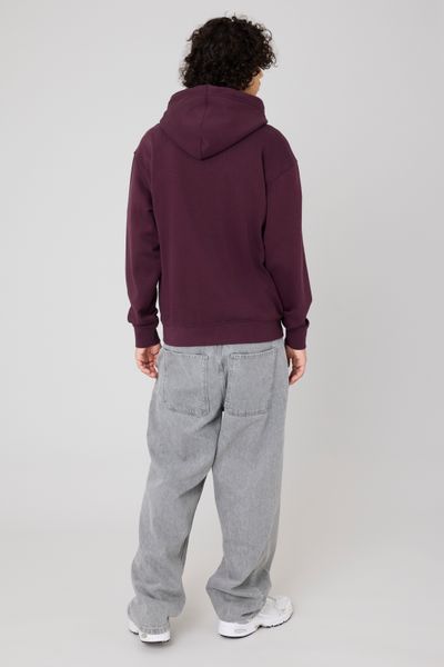 Sweat à capuche message brodé