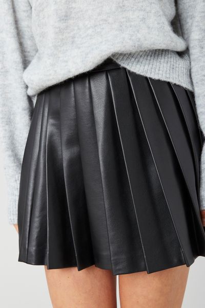 Jupe plissée en tissu enduit