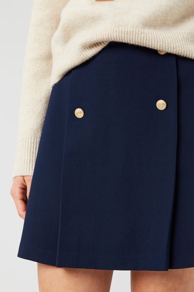 Jupe courte avec boutons dorés