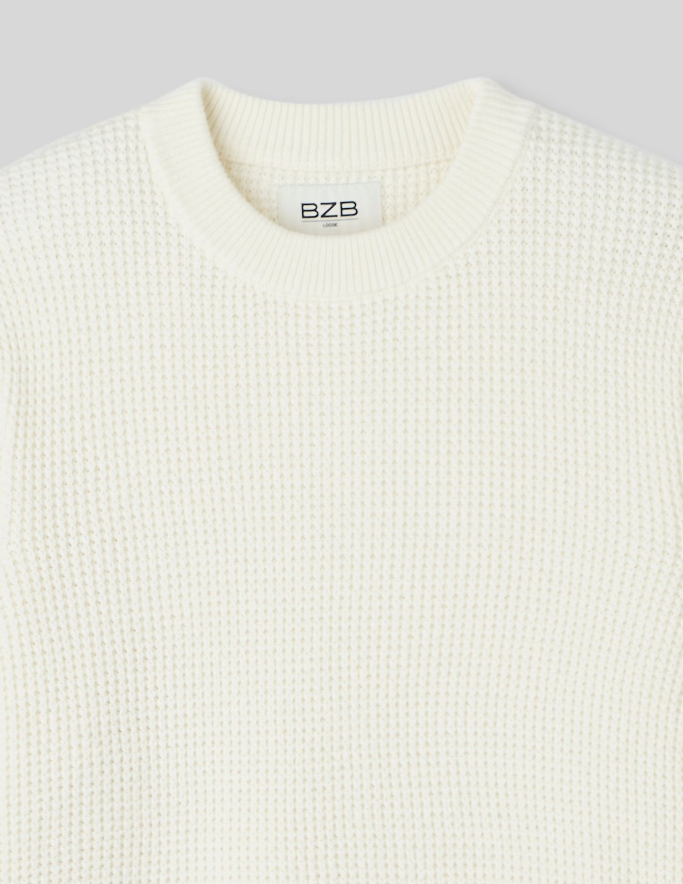 Pull col rond matière fantaisie