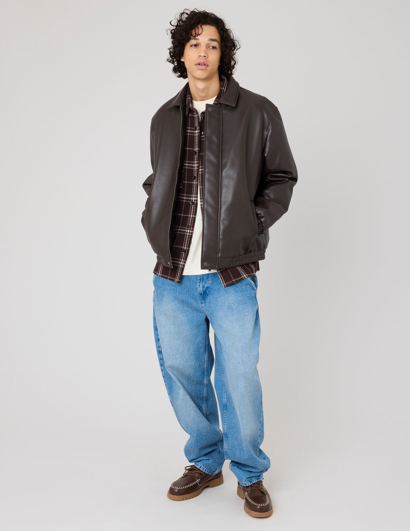 Blouson zippé en tissu enduit