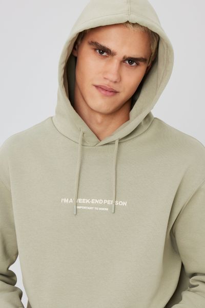 Sweat à capuche message brodé