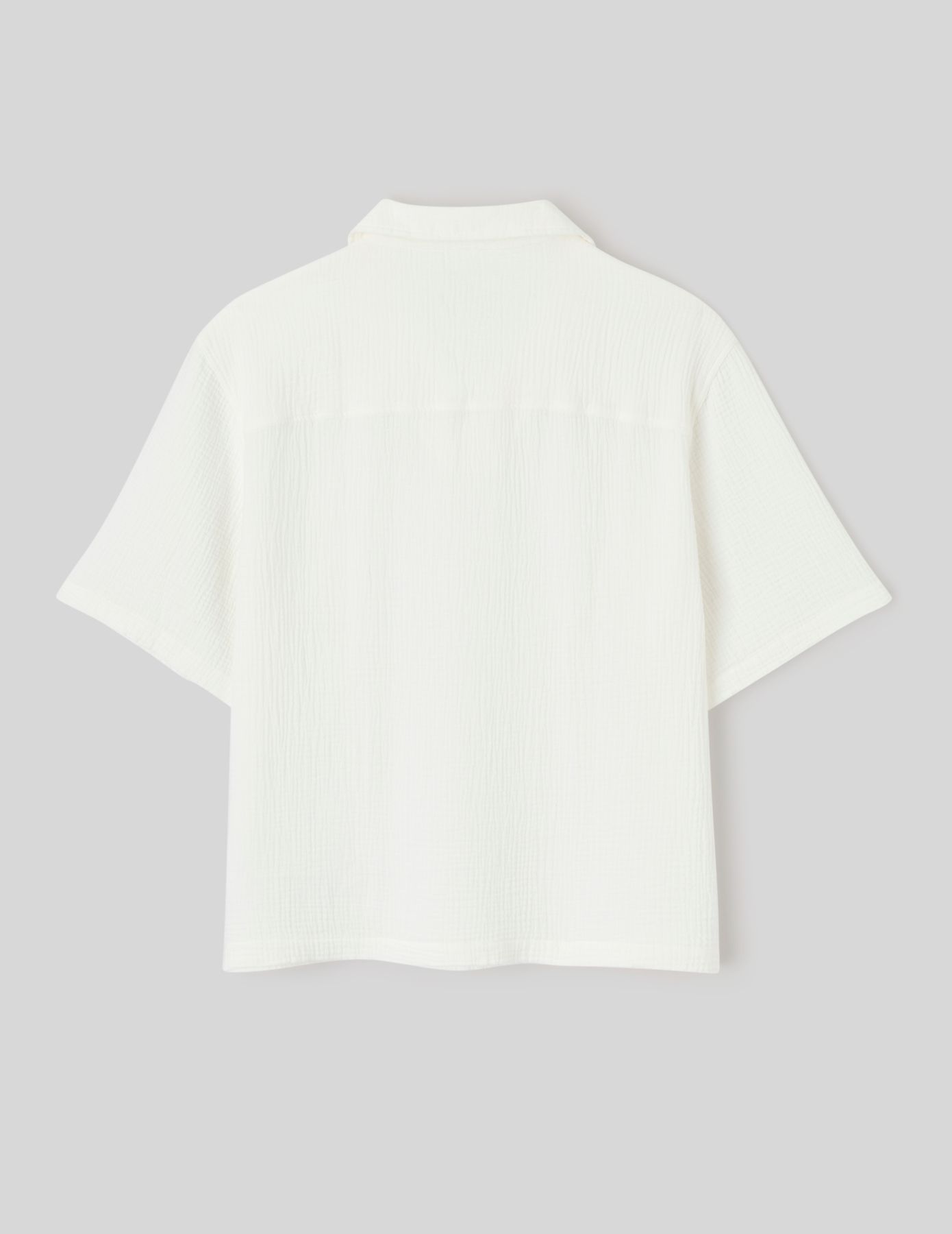 Polo en mati&egrave;re textur&eacute;e
