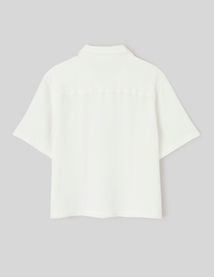 Polo en mati&egrave;re textur&eacute;e