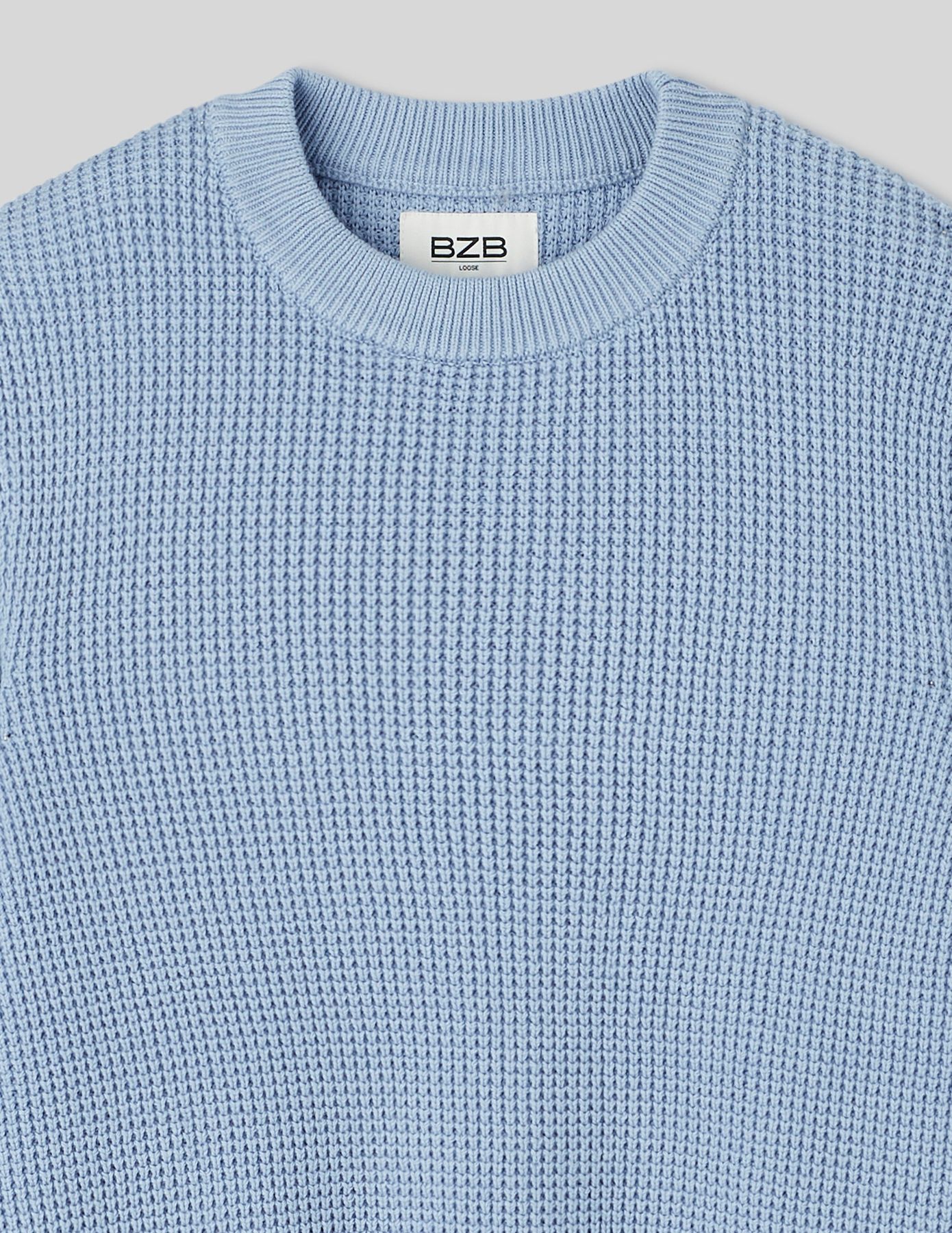 Pull col rond matière fantaisie