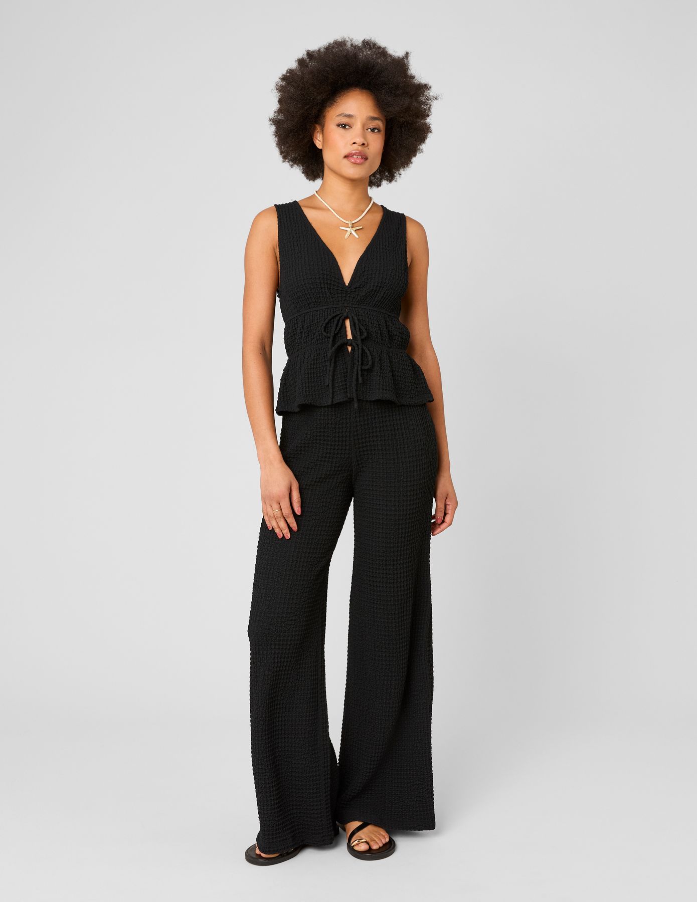 Pantalon fluide mati&egrave;re textur&eacute;e