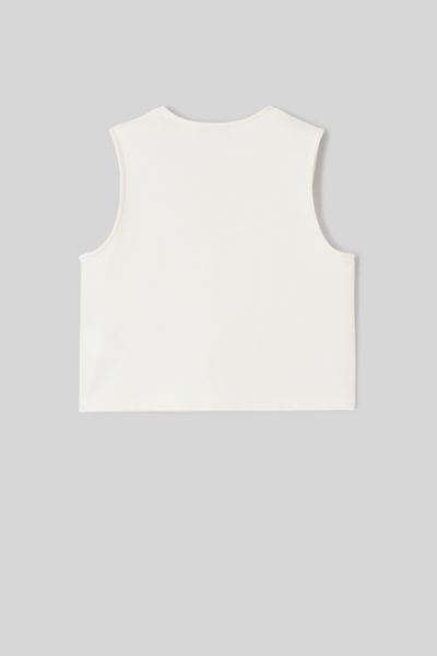 Top avec d&eacute;tails de boutons dor&eacute;s