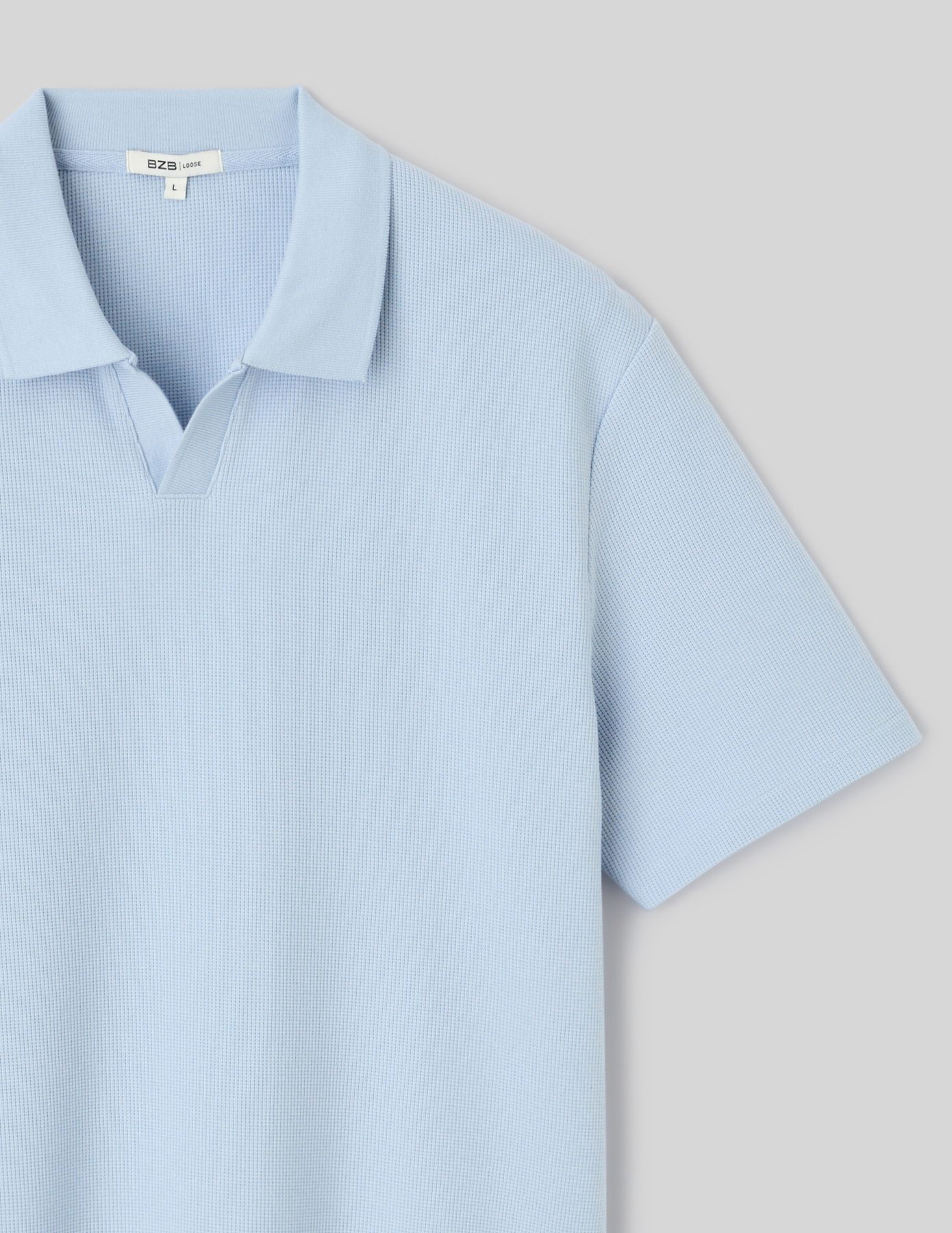 Polo mati&egrave;re gaufr&eacute;e