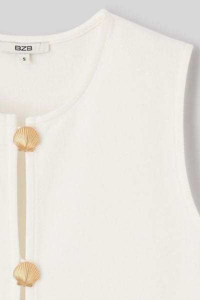 Top avec d&eacute;tails de boutons dor&eacute;s