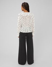 Blouse &agrave; volants motif pois